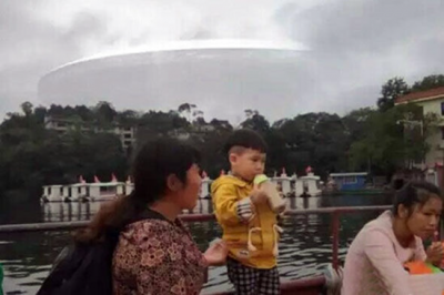 Huge cloaked UFO photographed travelling over China and India by many witnesses